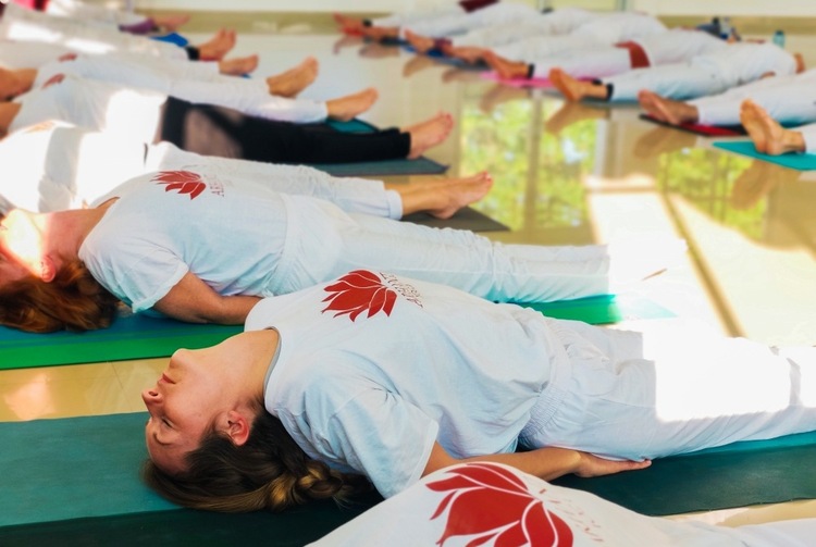 Yoga practitioners practice Yoga for Neck Pain at Arhanta Yoga Ashrams