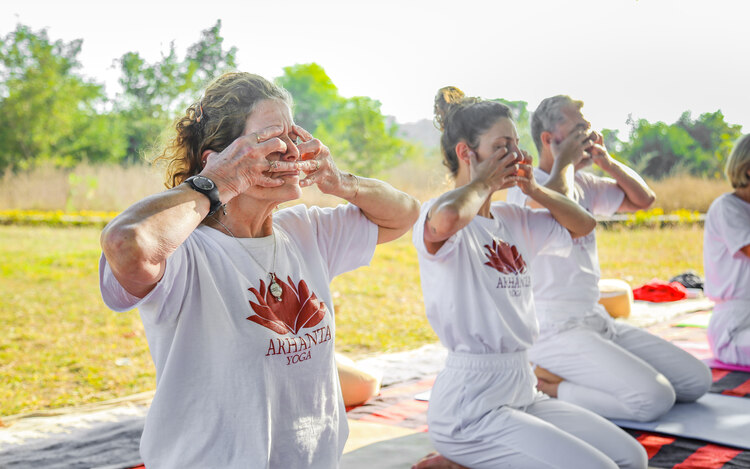 A group of yoga students practice for pranayama for metabolism increase at Arhanta Yoga 