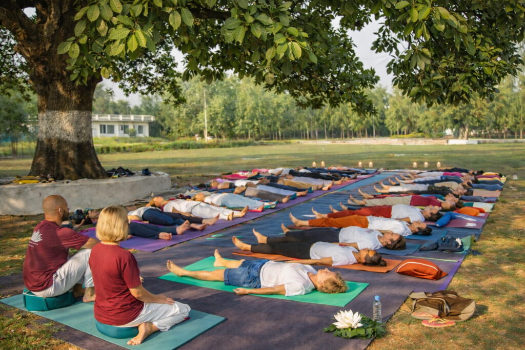 Students in corpse pose during final relaxation on the yoga training course in the Netherlands
