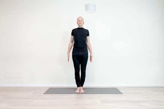 Yoga teacher demonstrating the mountain pose